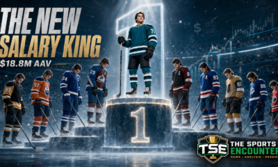 Macklin Celebrini stands at the top of a cinematic hockey podium as nine elite NHL stars acknowledge his record $18.8 million annual contract value.