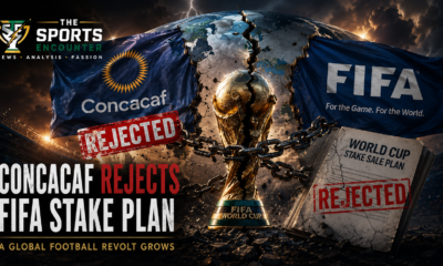 Cinematic VFX-style featured image showing a cracked FIFA World Cup trophy chained at the center beneath a fractured globe as CONCACAF rejects FIFA’s World Cup stake sale proposal. A CONCACAF flag with a red “Rejected” stamp faces a FIFA flag in a storm-lit stadium, with the headline “CONCACAF Rejects FIFA Stake Plan” and the official The Sports Encounter logo in the top-left.