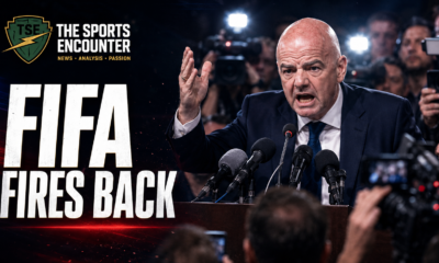 Gianni Infantino angrily addresses reporters at a tense press conference as cameras flash, alongside The Sports Encounter logo and the headline “FIFA Fires Back.”