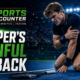 Cinematic VFX featured image showing a fictionalized British tennis player clutching his left arm in pain on a hard court, with The Sports Encounter logo and the headline “Draper’s Painful Setback.”