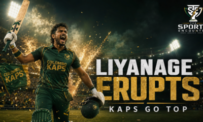 Janith Liyanage raises his bat and pumps his fist as Colombo Kaps teammates rush toward him following their LPL 2026 victory over Kandy Royals in Dambulla.