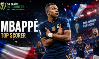 Kylian Mbappé celebrates a FIFA World Cup 2026 goal in his signature crossed-arms pose as France teammates and fans react inside a packed stadium.
