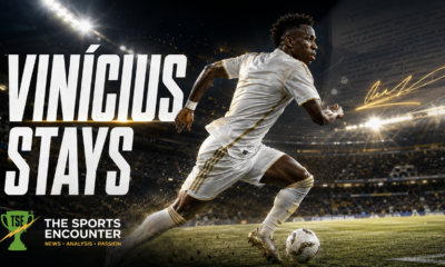Cinematic VFX artwork of Vinícius Júnior sprinting with the ball under stadium lights, symbolizing his decision to remain at Real Madrid as contract talks continue.