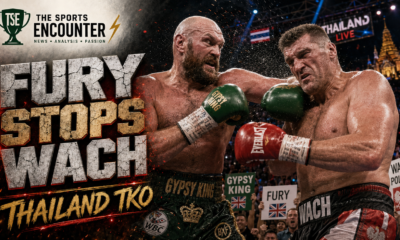 Tyson Fury and Mariusz Wach exchange heavy punches in an intense VFX-style boxing poster, with fans cheering behind them and The Sports Encounter logo on the design.