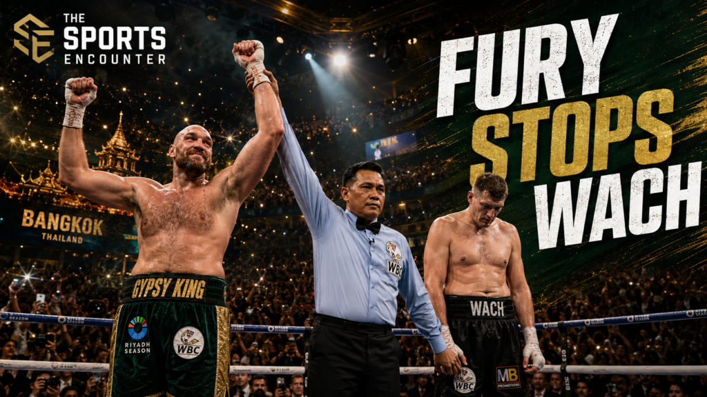 Tyson Fury celebrates victory in the ring as the referee raises his hand, while Mariusz Wach stands disappointed after their heavyweight fight in Thailand.