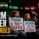 Two teenage fans hold signs supporting Sophie Cunningham as a Seattle Storm co-owner confronts them during a WNBA game, illustrating the incident that led to her suspension.