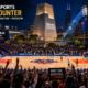 Fans cheer around a WNBA All-Star court at the Obama Presidential Center in Chicago, with event lights, community signs, city skyline, and The Sports Encounter logo.
