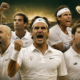 Roger Federer, Pete Sampras, Andre Agassi, Rafael Nadal, and Novak Djokovic celebrate their Wimbledon triumphs in a dramatic Centre Court collage featuring the championship trophy and The Sports Encounter logo.