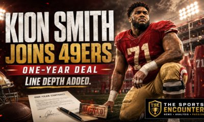 Cinematic NFL graphic showing Kion Smith in a generic red-and-gold No. 71 uniform at a floodlit training field, with a signed one-year contract, football equipment, the headline “Kion Smith Joins 49ers,” and The Sports Encounter logo.