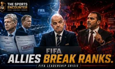 Gianni Infantino stands isolated at a FIFA podium as Arsène Wenger, Mattias Grafstrom, Prince Ali and divided football officials surround him, with fractured blue-and-red VFX imagery, The Sports Encounter logo, and the headline “Allies Break Ranks.”