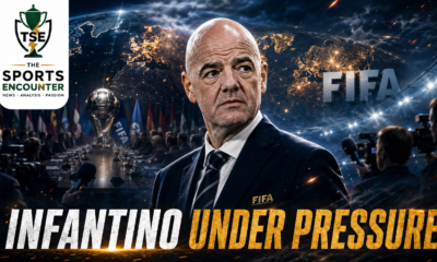 Gianni Infantino stands under intense scrutiny in a cinematic FIFA leadership crisis scene, surrounded by press cameras, officials, global football imagery, and the headline “Infantino Under Pressure.”