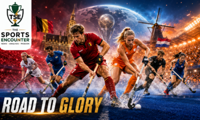 Field hockey players representing Belgium, the Netherlands and other competing nations battle for possession under dramatic stadium lights in a cinematic FIH Hockey World Cup 2026 scene, with The Sports Encounter logo and “Road to Glory” headline.