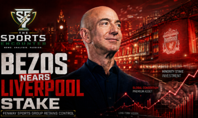 Jeff Bezos stands against a dramatic Anfield backdrop with financial market graphics, illustrating reports that he is part of a consortium nearing a major minority investment in Liverpool while Fenway Sports Group retains control.