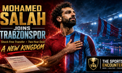 Cinematic Mohamed Salah transfer graphic showing a stylized bearded footballer in claret-and-blue colors, a glowing two-year free-transfer contract, Trabzon stadium atmosphere, the headline “Mohamed Salah Joins Trabzonspor,” and The Sports Encounter logo.