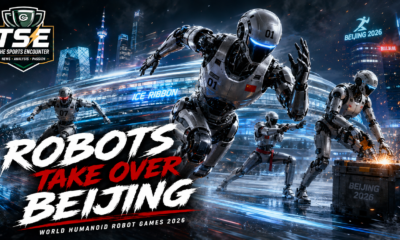 Humanoid robots competing under dramatic stadium lights in Beijing ahead of the 2026 World Humanoid Robot Games at the National Speed Skating Oval.