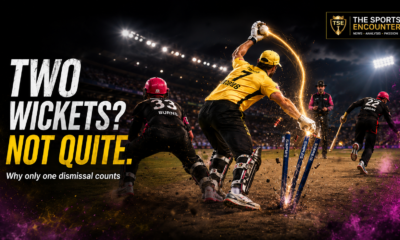 Alt text: A yellow-clad cricketer completes a catch and breaks the stumps as the non-striker runs short of the crease, illustrating why only one wicket counts from the delivery.