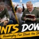 A cricket fan at Headingley reacts after spilling four pints during day two of the England-Pakistan Test while spectators laugh in the stands.