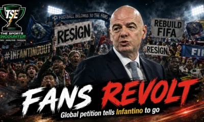 Gianni Infantino surrounded by protesting football supporters in a cinematic FIFA crisis visual highlighting the global petition demanding his resignation.