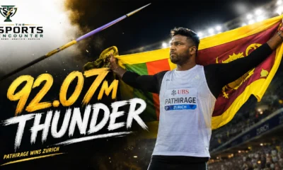 Rumesh Pathirage celebrates with the Sri Lankan flag after winning the Zurich Diamond League men’s javelin with a 92.07-meter throw.