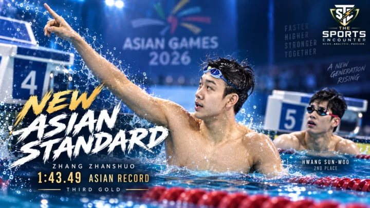 China’s Zhang Zhanshuo celebrates after swimming an Asian-record 1:43.49 to beat Hwang Sun-woo and win the men’s 200m freestyle at the 2026 Asian Games.