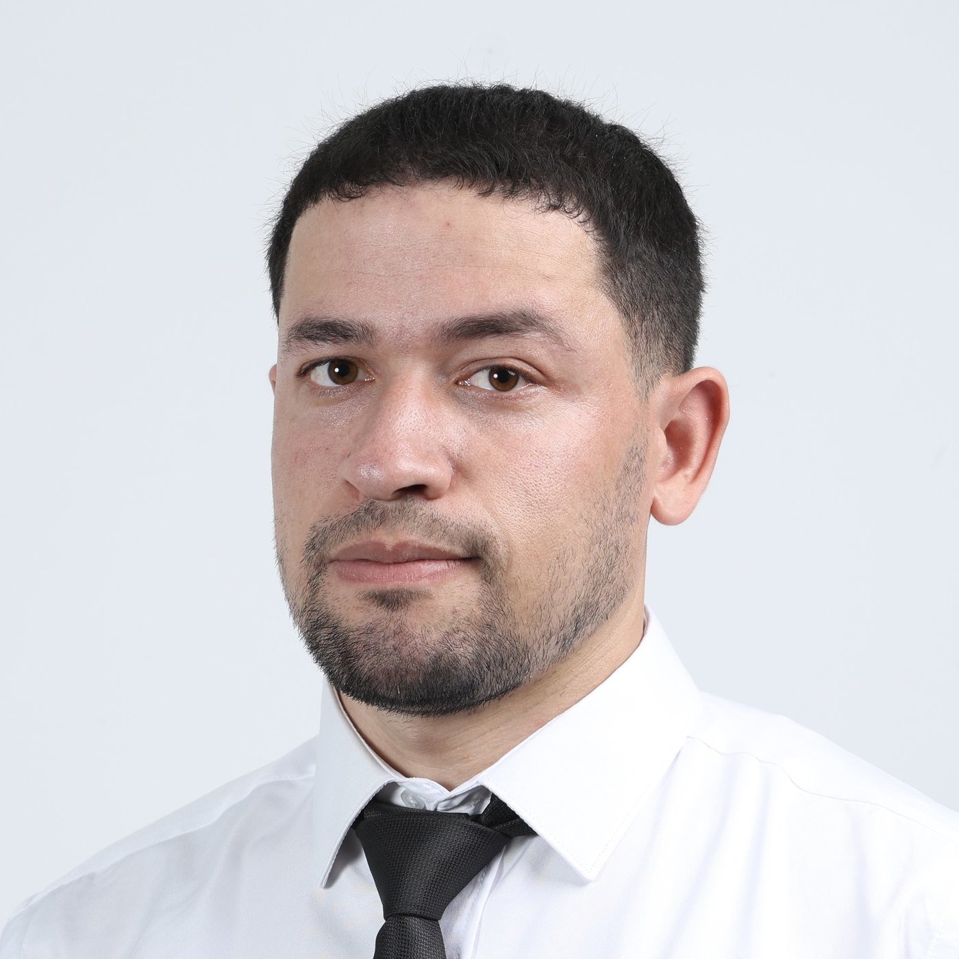 Faraj Rahil in a formal portrait